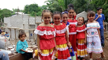 Children in front of school construction