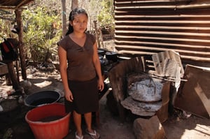 Erika before an eco-stove