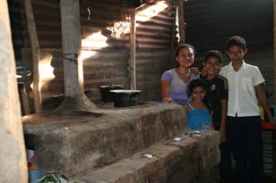 Erika and family with eco-stove