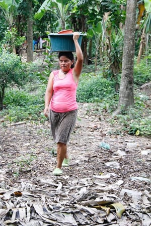 woman carrying water