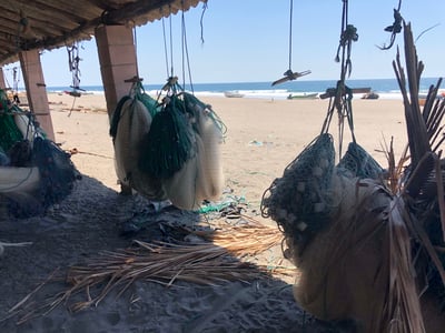 Hanging Fishing Nets on the Beach in Metalio